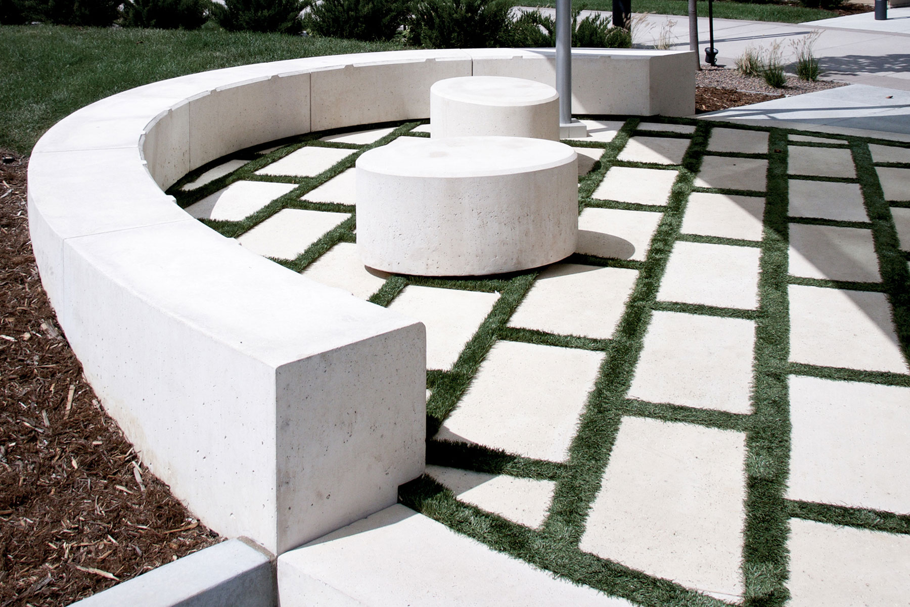 Healthy grass with Rectangle Pavers make a pleasant patio tiling