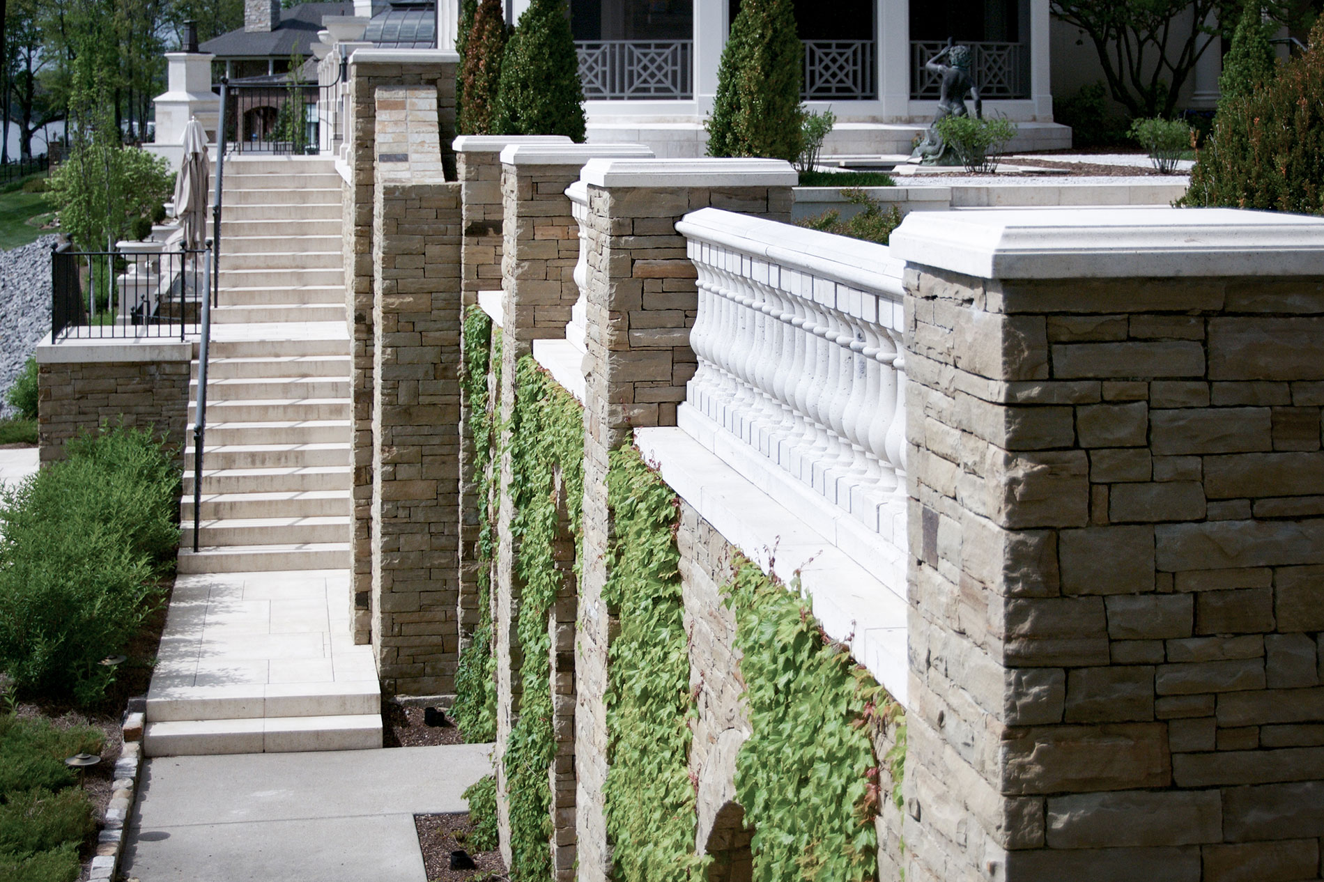 These stairs, with stair treads, have their landings paved with the same deck pavers