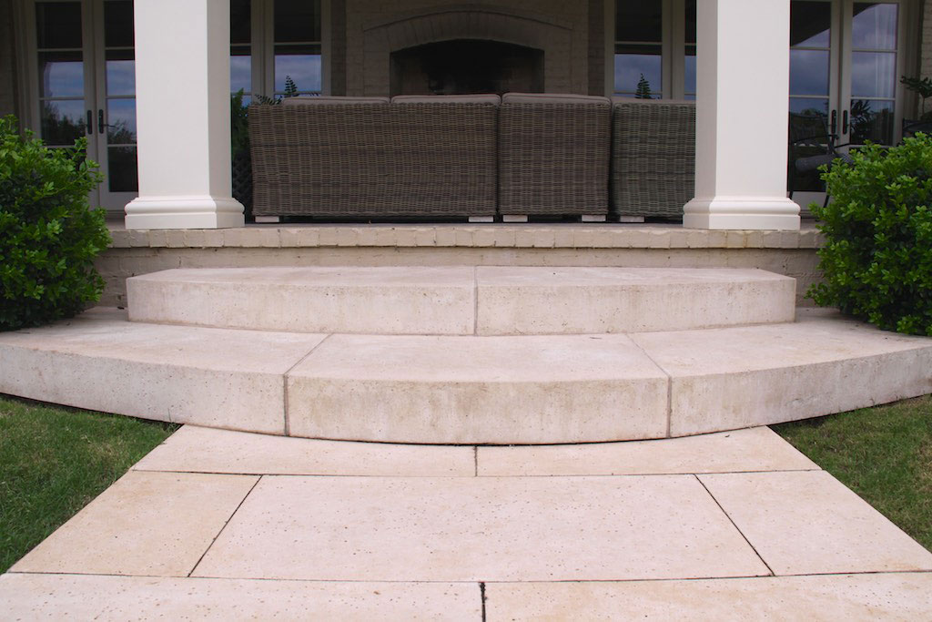 These custom radius slab steps were molded and cut by hand, and match the pool pavers