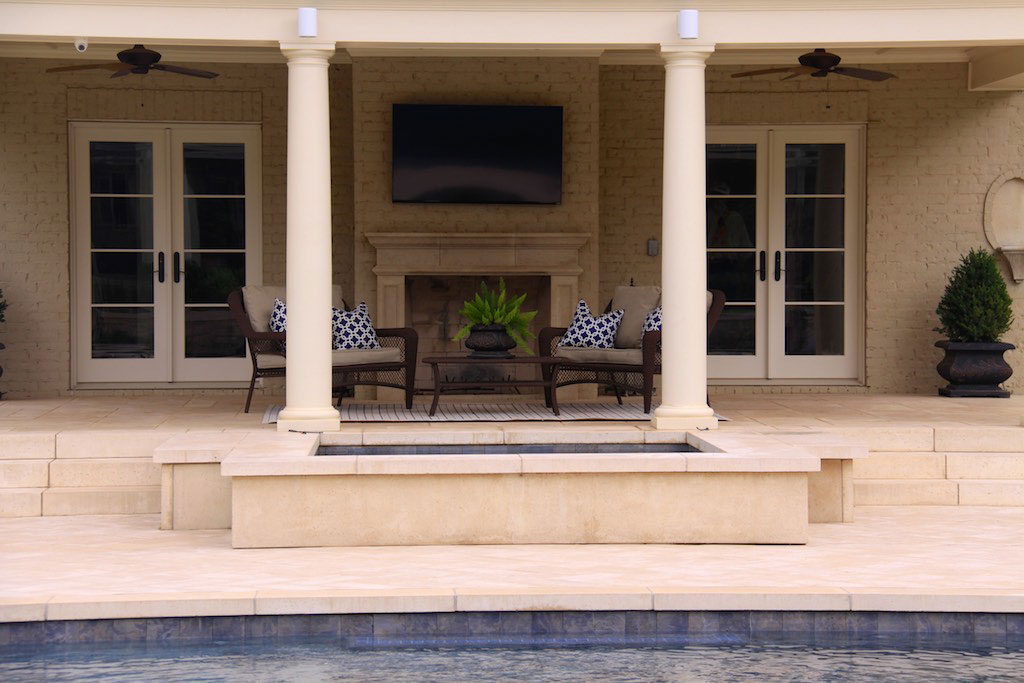 The Residential patio space is framed by deck columns and classical slab steps