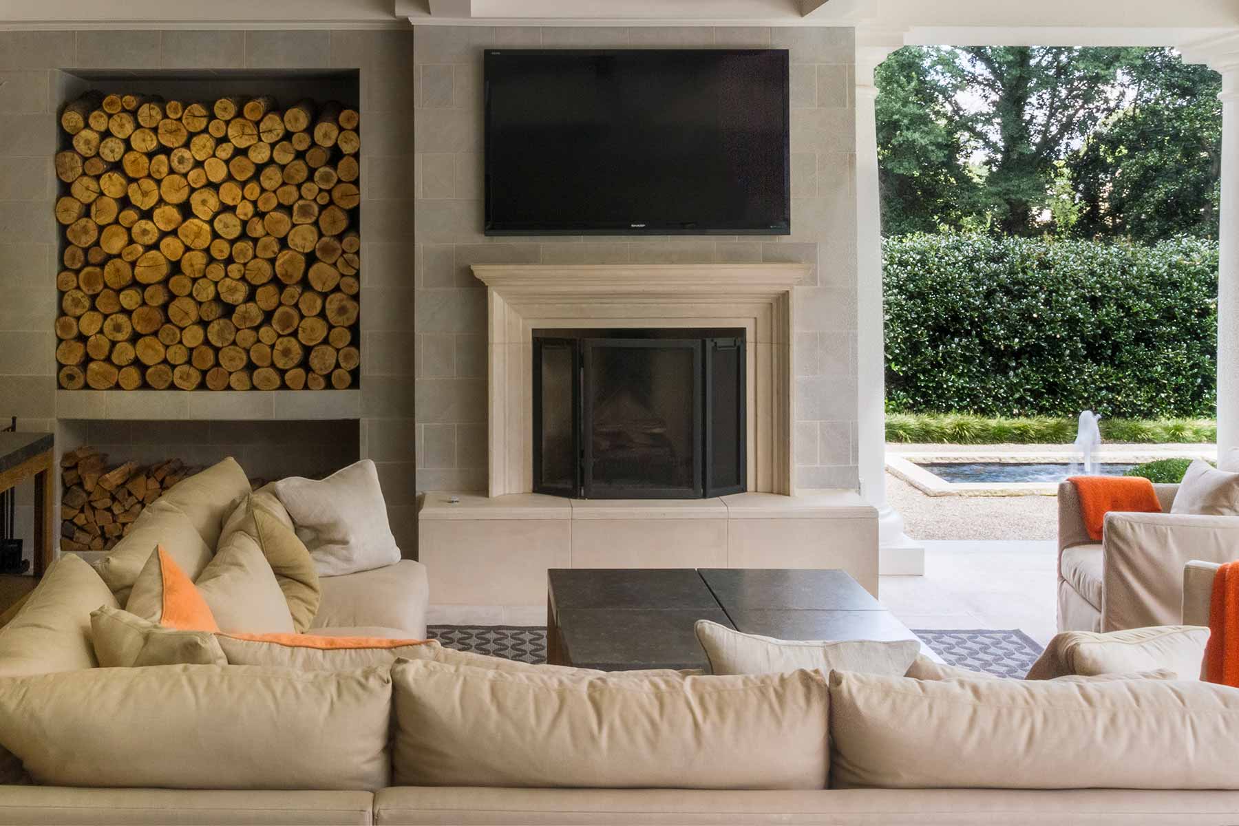 The tile fireplace mantle features finished harth tile which match the pool pavers