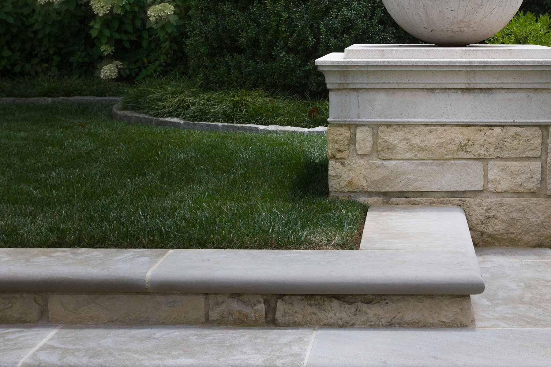 Detailing on the coping pavers leading to a large finial ball